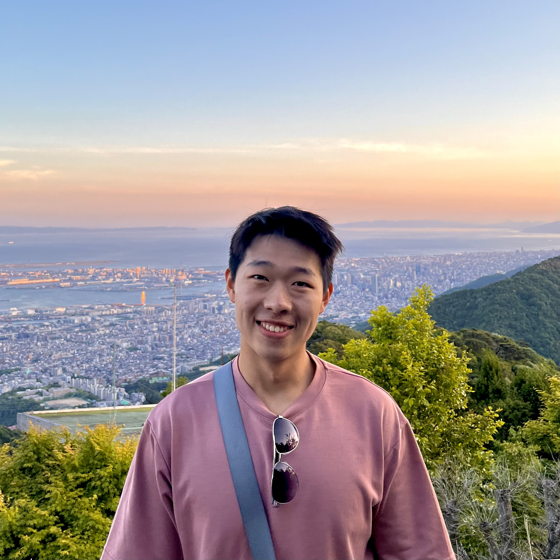 Leon standing in front of a sunset with Venice Beach in the background